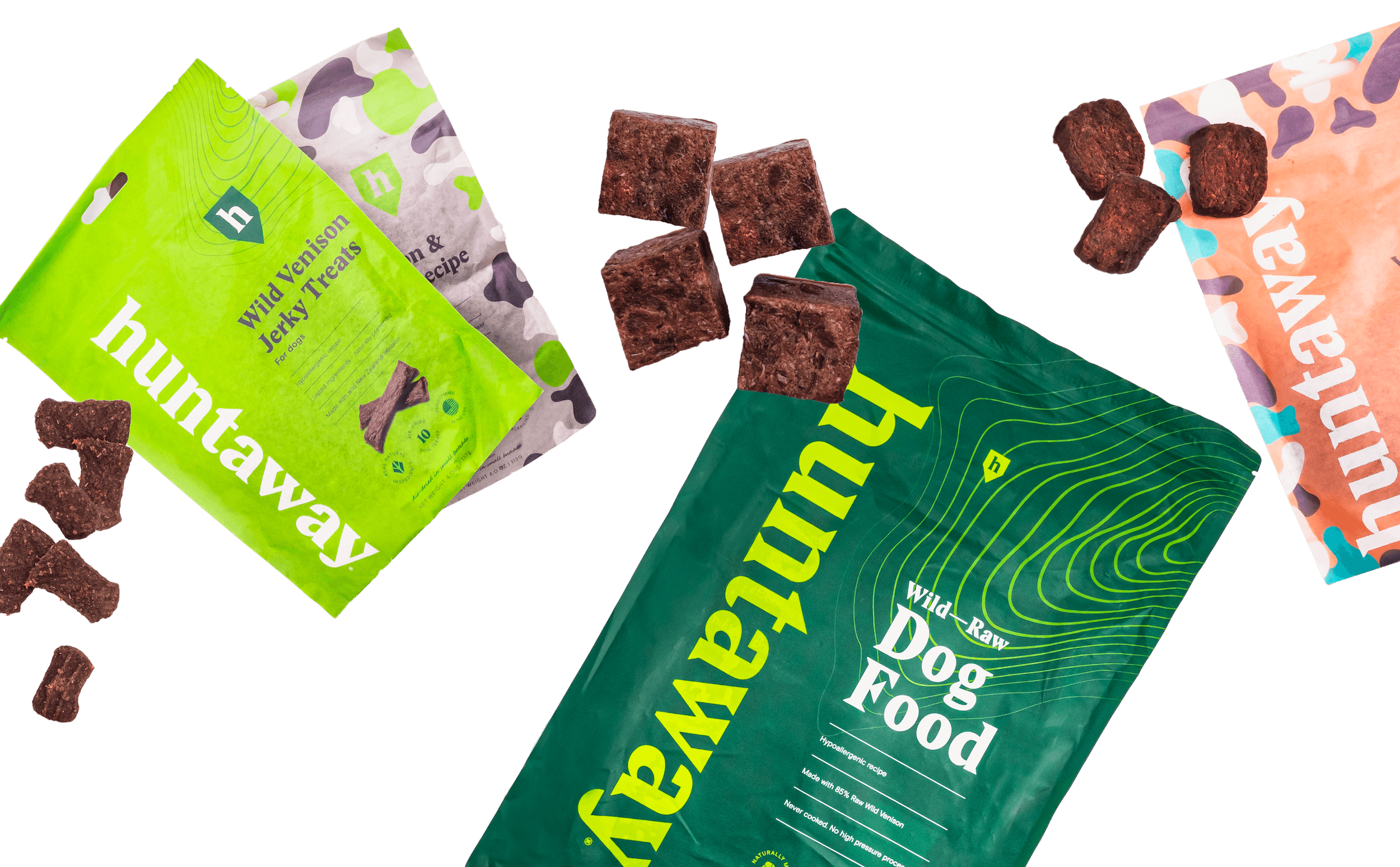 A flatlay of Huntaway wold venison jerky treats, wild raw venison dog food and other treats